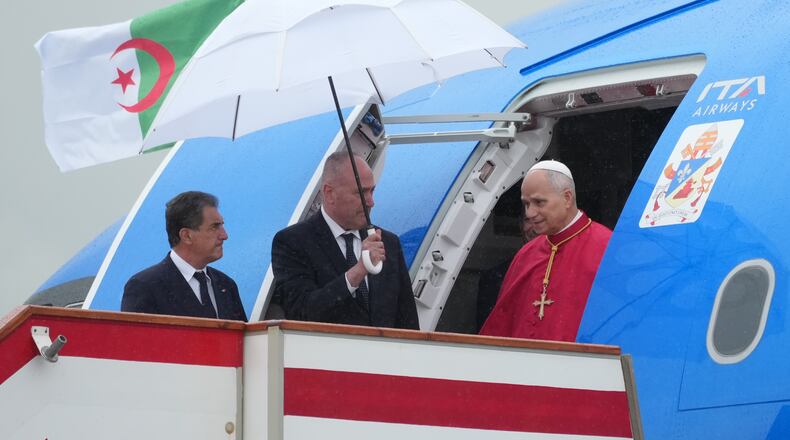 Pope Leo XIV arrives at Algiers' Houari Boumédiène International Airport on Monday, April 13, 2026, at the start of an 11-day apostolic journey to Africa. (AP Photo/Andrew Medichini)