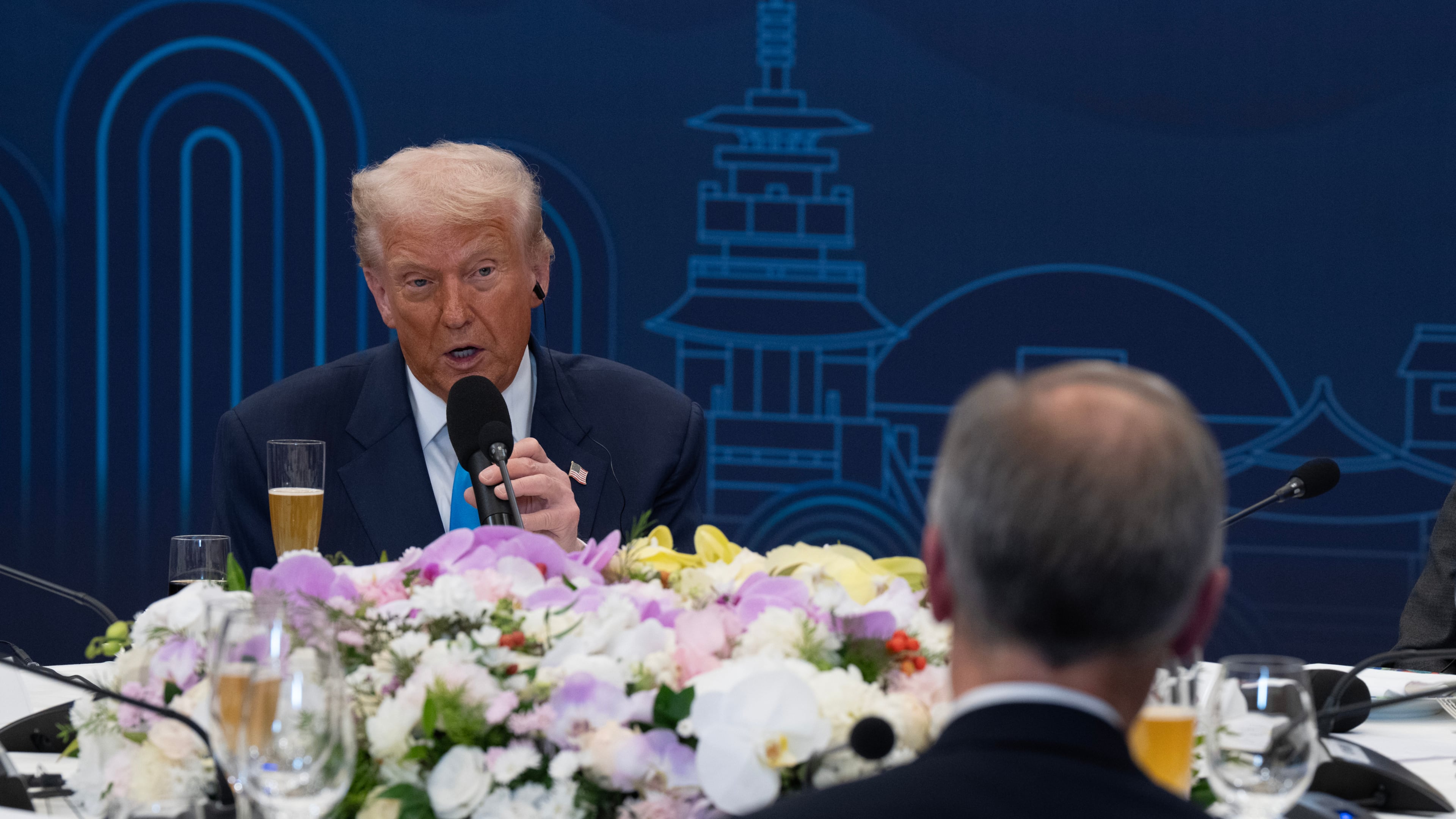 President Donald Trump looks towards Canada Prime Minister Mark Carney as he delivers remarks at a dinner hosted by South Korea President Lee Jae-Myung in Gyeongju, South Korea, Wednesday, Oct 29, 2025. (Adrian Wyld/The Canadian Press via AP)