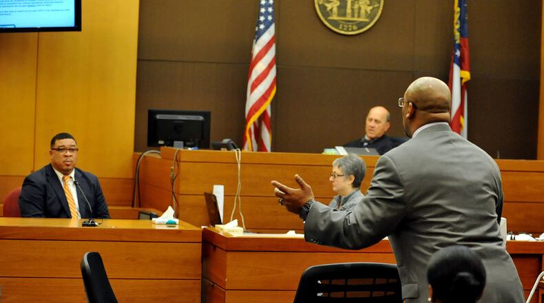 Fulton County Senior ADA Clint Rucker questions witness Dr. Curt Green, former principal at BEST Academy during his testimony Wednesday. Kent D. Johnson / KDJOHNSON@AJC.COM