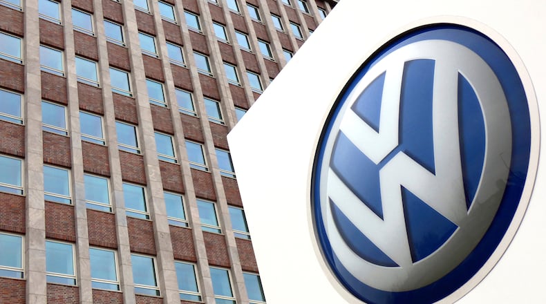 FILE - In this April 13, 2018 file photo, Volkswagen logo is pictured in front of a company building in Wolfsburg, Germany. (AP Photo/Michael Sohn, File)