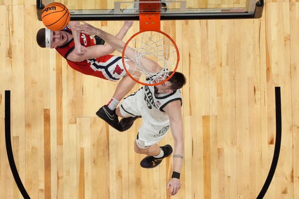 Mississippi guard Sean Pedulla (3) shoots against Michigan State center Carson Cooper (15) during the second half in the Sweet 16 of the NCAA college basketball tournament, Friday, March 28, 2025, in Atlanta. (AP Photo/George Walker IV)