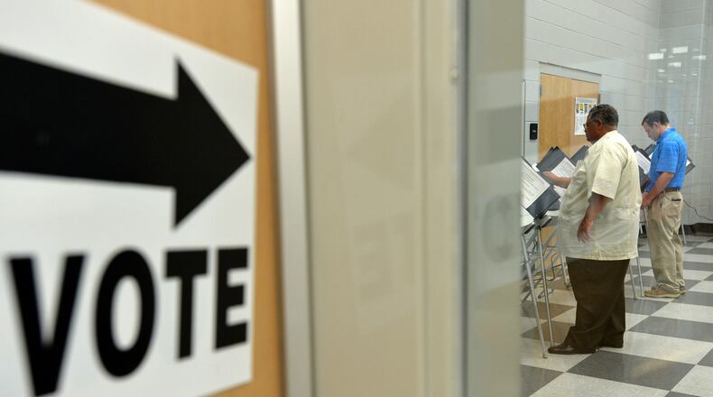May 2, 2014 Atlanta - Early voters cast their ballots at Adamsville Recreation Center, an early voting site, in Atlanta on Friday, May 2, 2014. HYOSUB SHIN / HSHIN@AJC.COM Early voters cast ballots ahead of last year's May primary. (AJC file/Hyosub Shin)