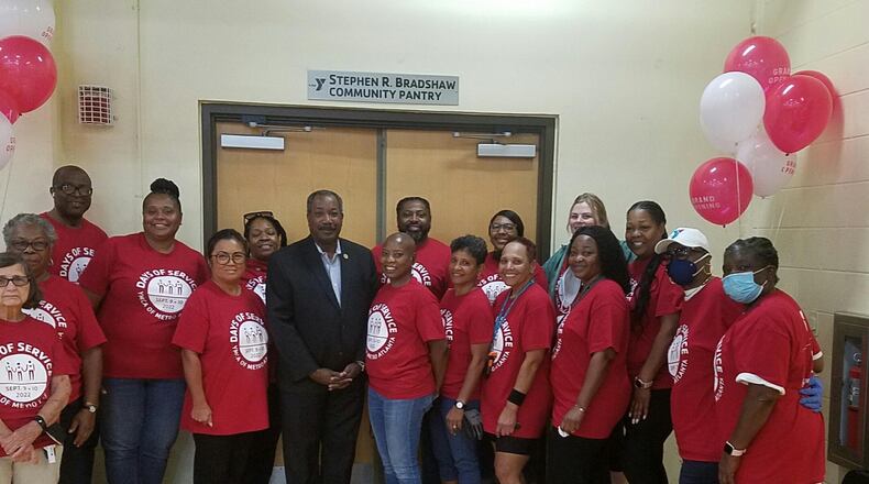 The Wade Walker YMCA recently named its new food pantry after DeKalb County Commissioner Steve Bradshaw (center). SPECIAL PHOTO