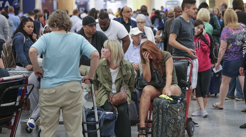 Airport and TSA officials hope to avoid logjams at security checkpoints in Atlanta this spring and summer. JOHN SPINK /JSPINK@AJC.COM