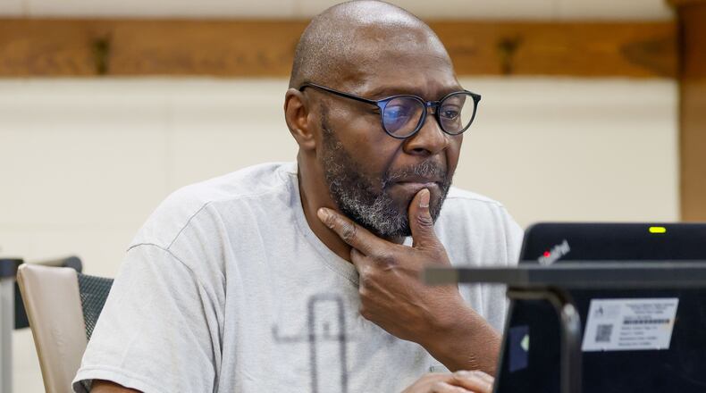 James Mullins, 62, focuses on his laptop during a class at the APS Adult Education Center in southeast Atlanta on Wednesday, Feb. 28, 2024. (Miguel Martinez / miguel.martinezjimenez@ajc.com)