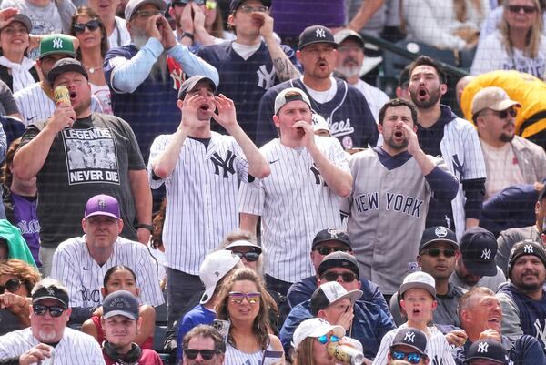 Fans boo when New York Yankees' Aaron Judge is given an intentional walk in the fifth inning of a baseball game against the Colorado Rockies, Saturday, May 24, 2025, in Denver. (AP Photo/David Zalubowski)