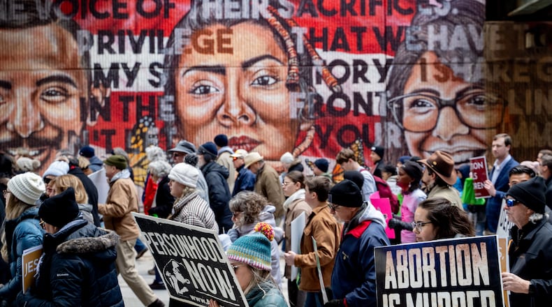 Georgia Right To Life holds a silent march in the streets of downtown Atlanta to commemorate the anniversary of the 1973 Supreme Court ruling in Roe v Wade on Friday, Jan. 24, 2025 (Ben Hendren for the Atlanta Journal-Constitution)