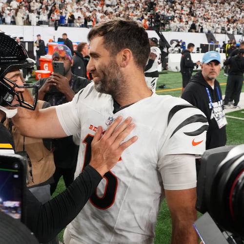 Pittsburgh Steelers quarterback Aaron Rodgers (8) and Cincinnati Bengals quarterback Joe Flacco, right, meet on the field following an NFL football game in Cincinnati, Thursday, Oct. 16, 2025. (AP Photo/Jeff Dean)