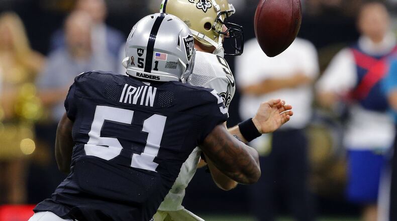 New Orleans Saints quarterback Drew Brees (9) fumbles as he is hit by Oakland Raiders linebacker Bruce Irvin (51) in the first half of an NFL football game in New Orleans, Sunday, Sept. 11, 2016. (AP Photo/Butch Dill)