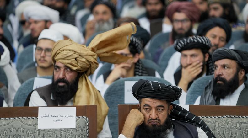 Taliban delegates from across the country attend a meeting that opens celebrations marking the fifth anniversary of the U.S. withdrawal and the start of Taliban rule, at the Loya Jirga Hall in Kabul, Afghanistan, Saturday, Aug. 15, 2026. (AP Photo/Siddiqullah Alizai)