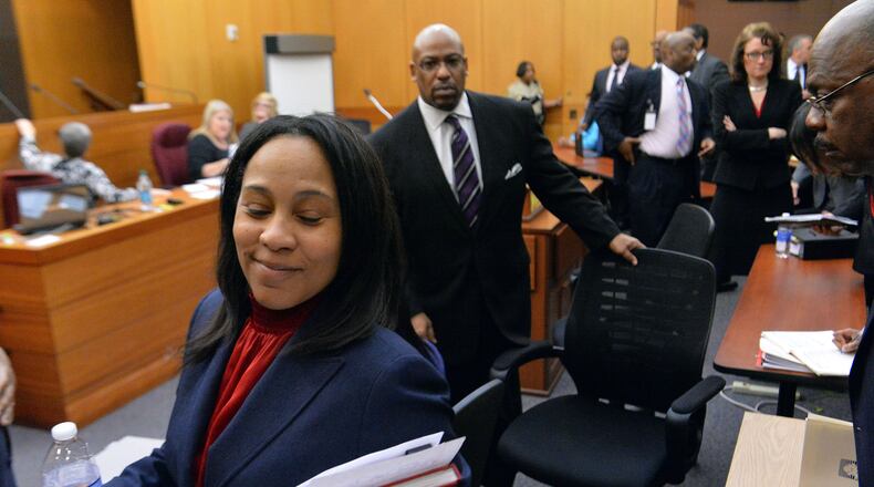 APRIL 14, 2015 ATLANTA Fulton County Chief Senior Asst DA Fani Willis smiles as she walks out of the courtroom following sentencing. Sentencing was completed for 10 of the 11 defendants convicted of racketeering and other charges in the Atlanta Public Schools test-cheating trial before Judge Jerry Baxter in Fulton County Superior Court, Tuesday, April 14, 2015. (Atlanta Journal-Constitution, Kent D. Johnson, Pool) After working with attorneys and prosecutors on the case for nearly two years, both sides became comfortable with me pointing cameras at them. My goal was to cover the trial fairly, the highs as well as the lows. Catching one of the prosecutors with a satisfied smile for a job done well was one of those. Taken on Tue, April 14, 2015 with NIKON D4, on Manual, 1/250 sec, 24.0-70.0 mm f/2.8 lens at 32mm, f/5.6, 12800 ISO