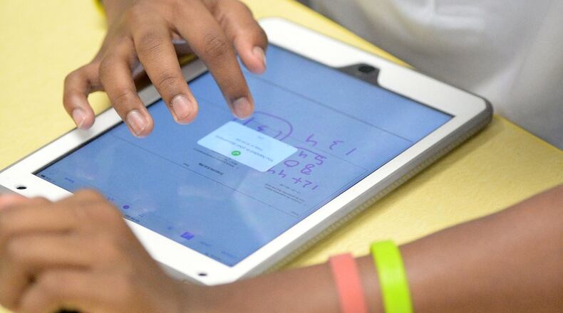 Fulton County Schools plans to buy more iPads for its youngest students to use in classrooms. KENT D. JOHNSON/ AJC FILE PHOTO