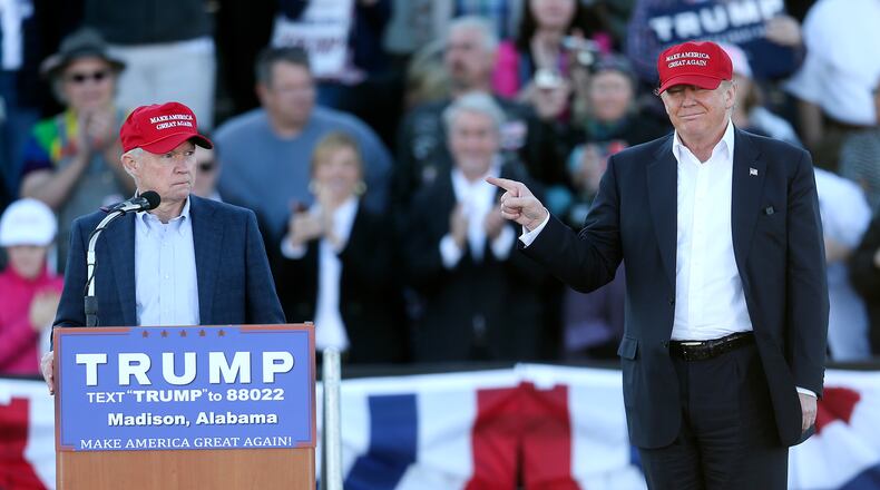 Republican presidential candidate Donald Trump, right, gestures as Sen. Jeff Sessions, R-Ala., speaks during a rally on Sunday in Madison, Ala. AP/John Bazemore