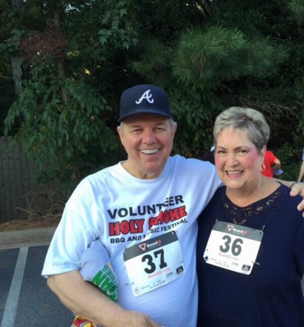Jeanne Cathell and her husband, Steve, have been losing weight. Here, Jeanne weighed 256 pounds in August 2015 with her husband at their first 5K. CONTRIBUTED BY KATIE CATHELL WITH KVC PHOTOGRAPHY
