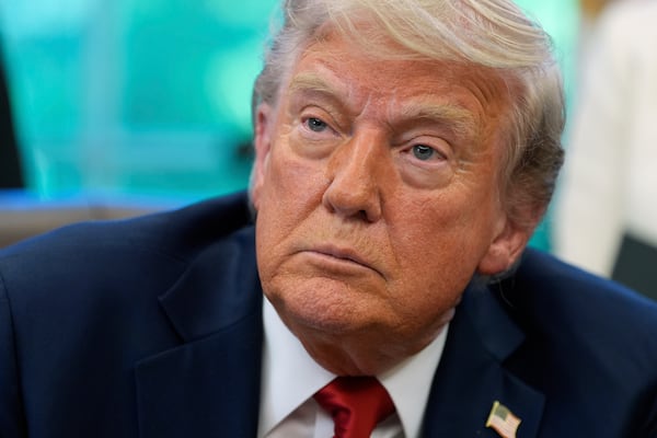 President Donald Trump speaks with reporters after signing executive orders in the Oval Office of the White House, Wednesday, April 23, 2025, in Washington. (AP Photo/Alex Brandon)