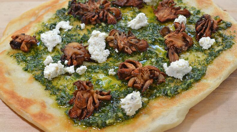 Flatbread with Woodsman & Wife fromage blanc, roasted mushrooms and pesto from The General Muir restaurant. The General Muir 1540 Avenue Place, Atlanta. 678-927-9131, thegeneralmuir.com. Photo credit: Chris Hunt