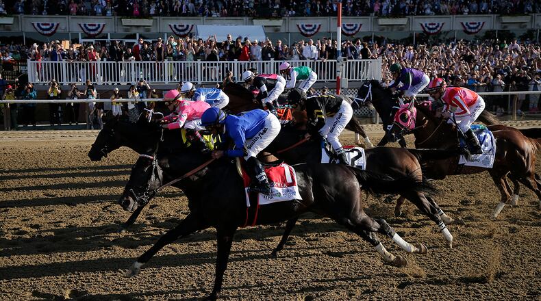 Thorougbreds break out of the starting gate at the beginning of the 151st running of the Belmont Stakes horse race, Saturday, June 8, 2019, in Elmont, N.Y. Sir Winston won the race. (AP Photo/Seth Wenig)
