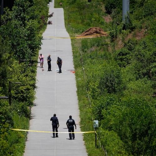 Crime scene tape blocks off a portion of the Beltline near Flagler Avenue Northeast, where Atlanta police say they are responding to a report of a person stabbed. (Ben Hendren for the AJC)