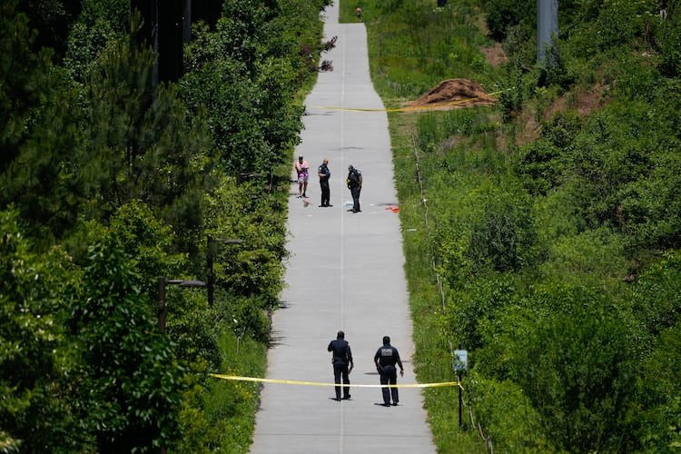Crime scene tape blocks off a portion of the Beltline near Flagler Avenue Northeast, where Atlanta police say they are responding to a report of a person stabbed. (Ben Hendren for the AJC)