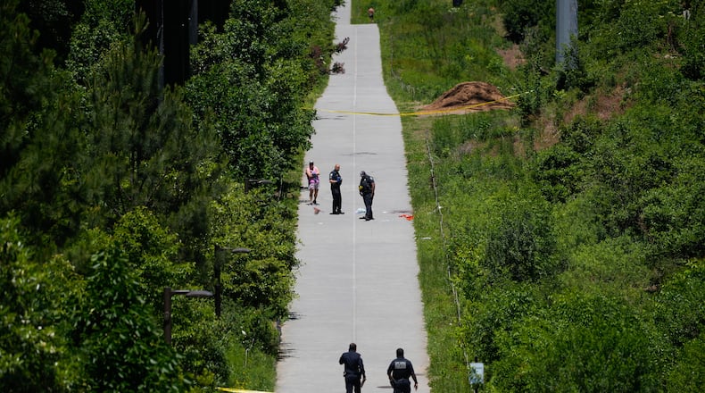 Crime scene tape blocks off a portion of the Beltline near Flagler Avenue Northeast, where Atlanta police say they are responding to a report of a person stabbed. (Ben Hendren for the AJC)