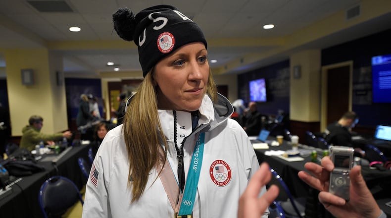 FILE - Meghan Duggan listens to a question from the media, March 3, 2018, in Annapolis, Md. (AP Photo/Nick Wass, File)