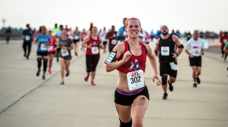 Some of the 1985 runners that participated in the Mayor's 5K on the 5th Runway head for the finish line at Hartsfield-Jackson Atlanta International Airport Saturday, August 27, 2016. This year's race raised $185.340 for United Way of Greater Atlanta. STEVE SCHAEFER / SPECIAL TO THE AJC