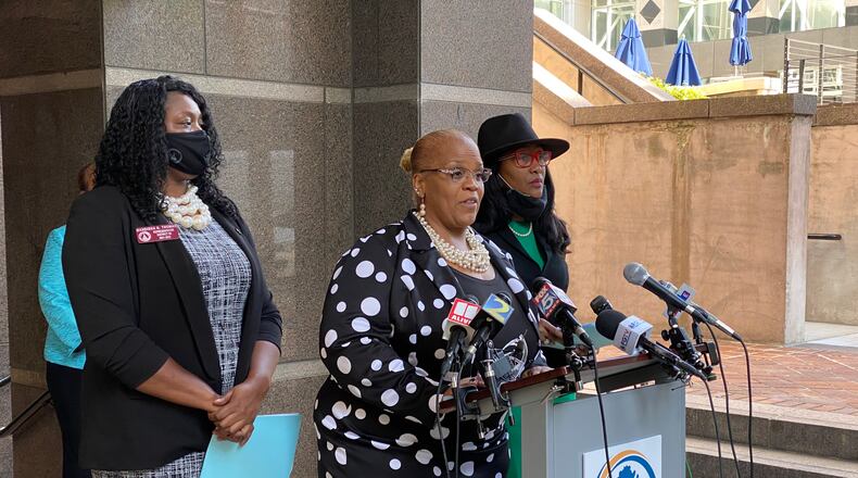 Fulton County Commissioner Khadijah Abdur-Rahman speaks outside 141 Pryor St. in downtown Atlanta about her resolution against SB 202. (Ben Brasch/AJC)