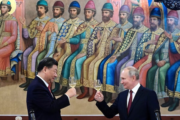 FILE - Russian President Vladimir Putin, right, and Chinese President Xi Jinping raise a toast at their dinner in the Hall of Facets in the Kremlin in Moscow on March 21, 2023. (Pavel Byrkin, Sputnik, Kremlin Pool Photo via AP, File)