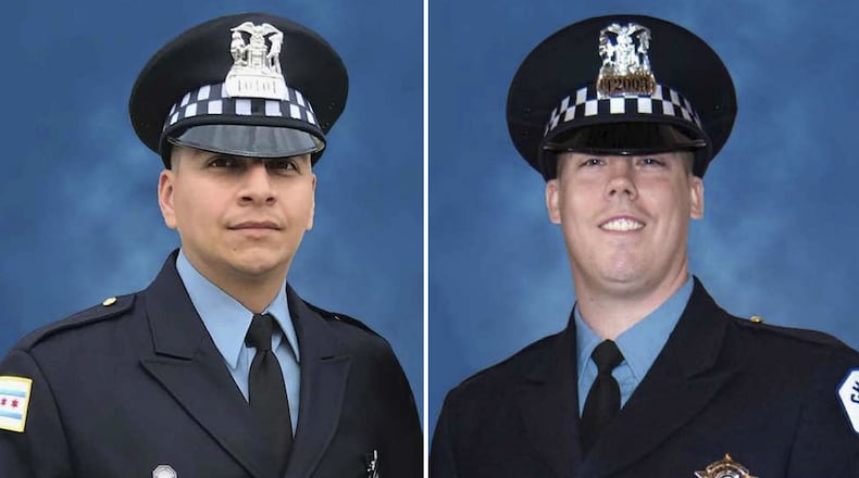Chicago police Officer Eduardo Marmolejo, left, and Officer Conrad Gary, right, were struck and killed by a train as they chased a possible shooting suspect Monday, Dec. 17, 2018.