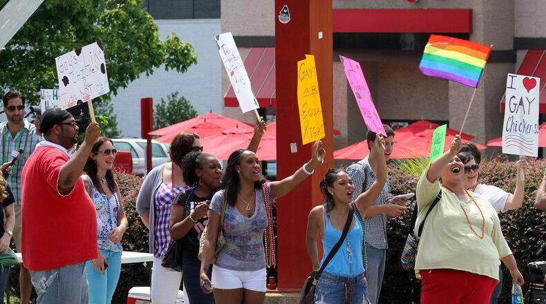 Only three years ago, gay marriage supporters gathered at the Chick-fil-A store in Decatur for a "kiss-in" protest of company president Dan Cathy's stand in opposition to gay marriage. AJC file