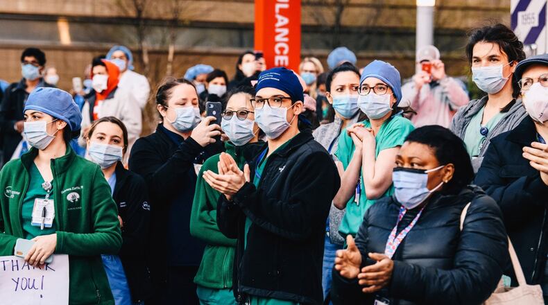 Medical workers in April. Despite the intense need for treatment of COVID-19 patients, many other procedures are not being done and millions of healthcare workers have been laid off or furloughed. (Bloomberg photo by Nina Westervelt)