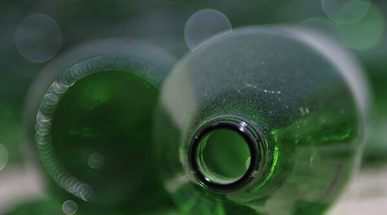 Alpharetta residents would continue to put glass out with curbside recyclables, but in a separate container and at additional cost under a proposal being considered by the City Council. AJC FILE