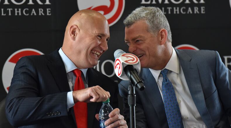 Hawks GM Travis Schlenk (left) and Hawks principal owner Tony Ressler share a laugh before the press conference to officially introduce new general manager Travis Schlenk at Philips Arena on Friday, June 2, 2017. HYOSUB SHIN / HSHIN@AJC.COM