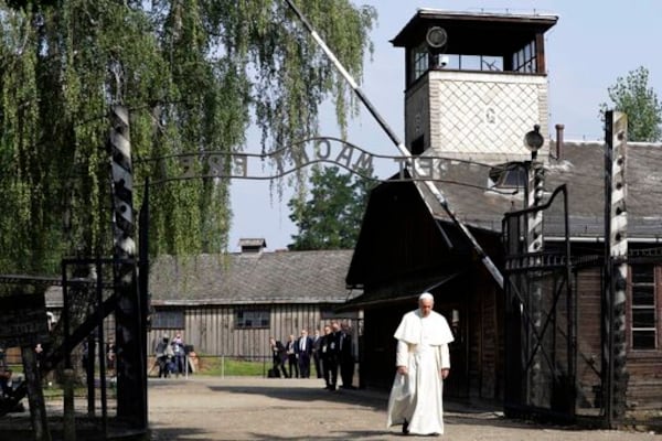 FILE - Pope Francis walks through the gate of the former Nazi German death camp of Auschwitz in Oswiecim, Poland, Friday, July 29, 2016. (AP Photo/Gregorio Borgia, file)