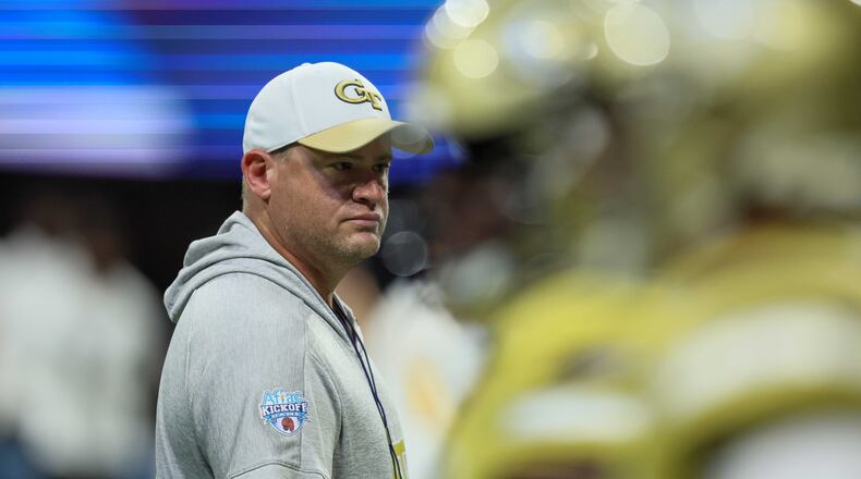 Georgia Tech coach Brent Key watches players warm up before their game against Louisville in the Aflac Kickoff Game at Mercedes-Benz Stadium, Friday, September 1, 2023, in Atlanta. (Jason Getz / Jason.Getz@ajc.com)