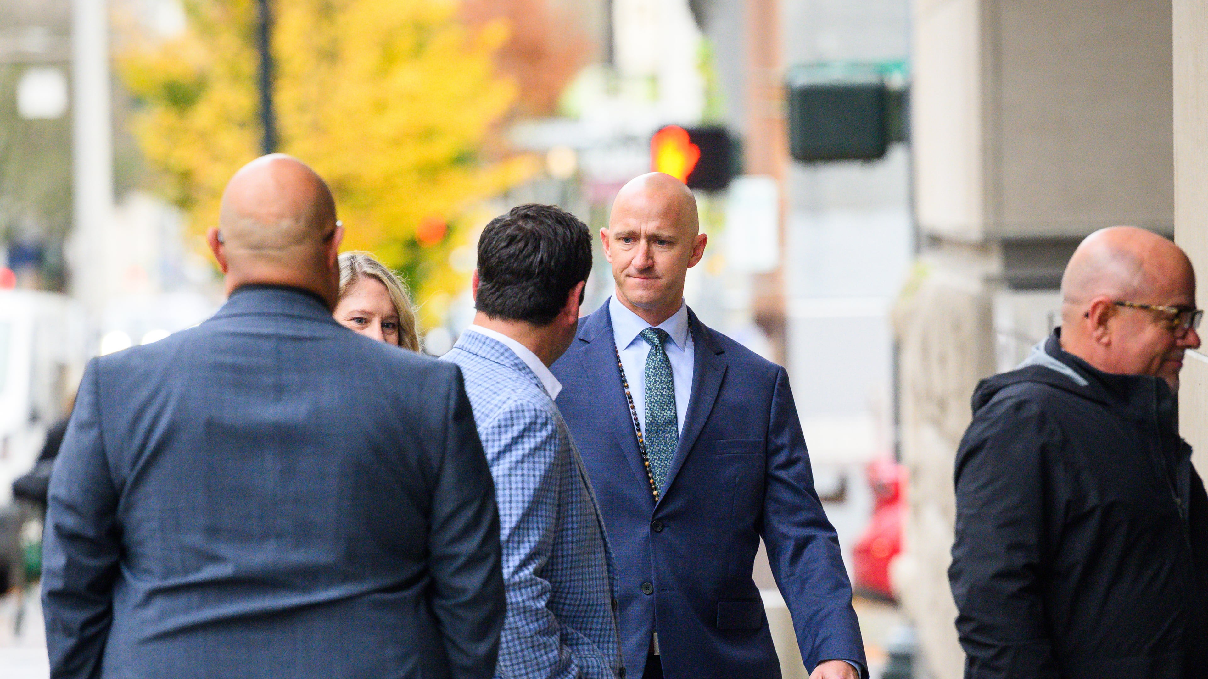 Former Alaska Airlines pilot Joseph Emerson, center, walks into U.S. District Court in Portland, Ore., Monday, Nov. 17, 2025. (AP Photo/Molly J. Smith)
