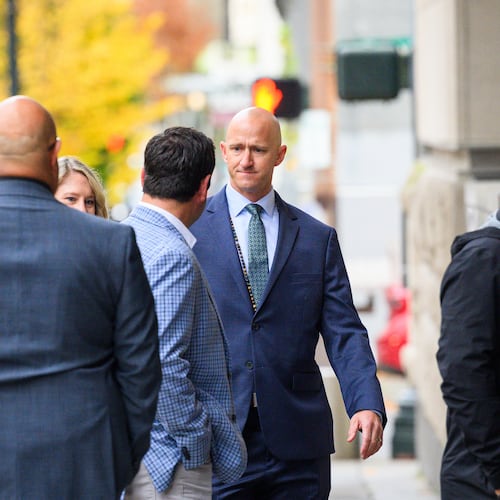 Former Alaska Airlines pilot Joseph Emerson, center, walks into U.S. District Court in Portland, Ore., Monday, Nov. 17, 2025. (AP Photo/Molly J. Smith)