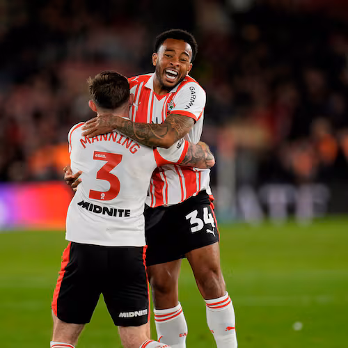Southampton's Welington, right, and Ryan Manning celebrate at the final whistle in the EFL Championship play off semifinal soccer game between Southampton and Middlesbrough, Tuesday, May 12, 2026, in, Southampton, England. (Andrew Matthews/PA via AP)