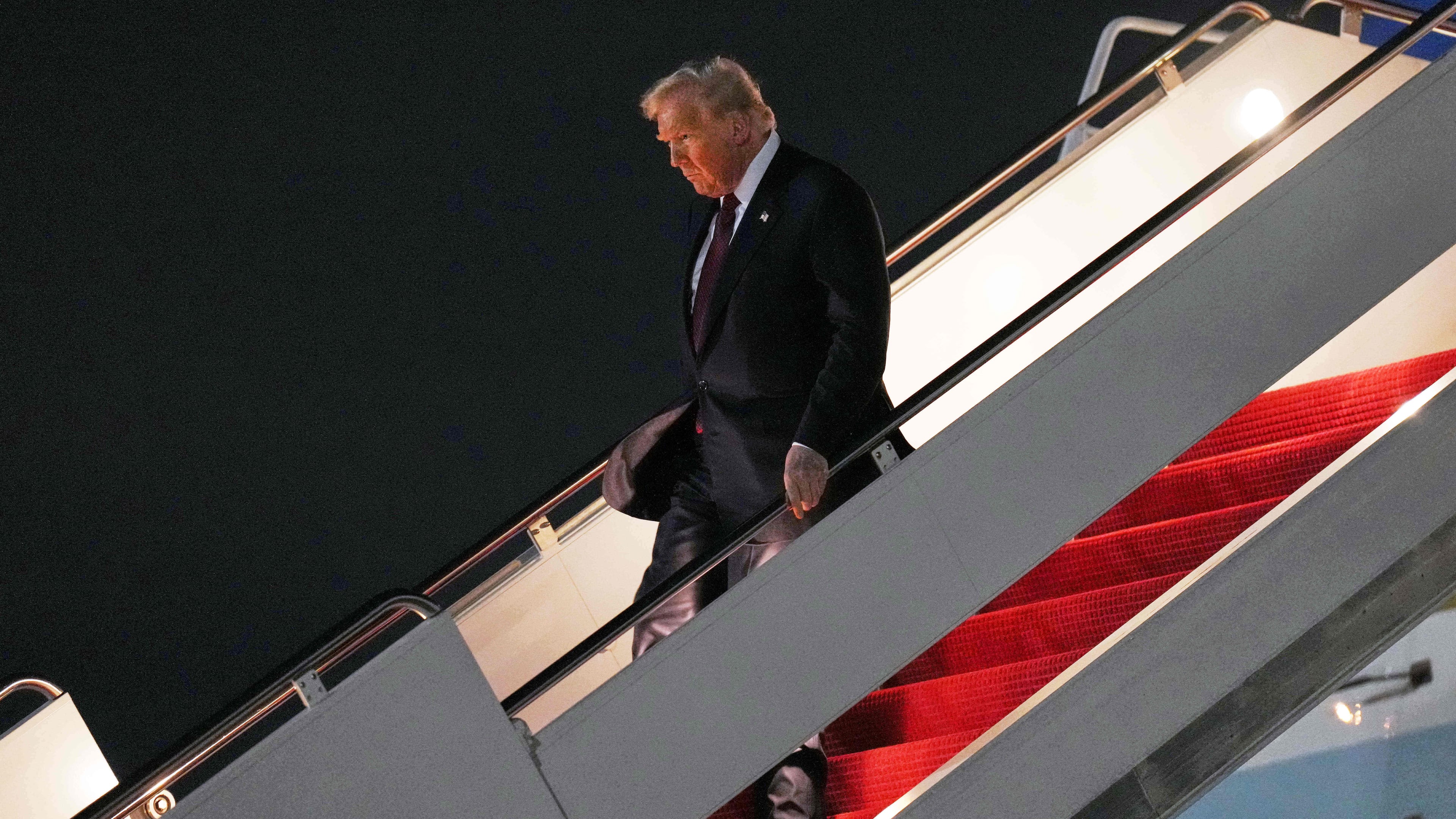 President Donald Trump walks off Air Force One, Wednesday, Nov. 5, 2025, at Joint Base Andrews, Md., after a day trip to Miami. (AP Photo/Jacquelyn Martin)