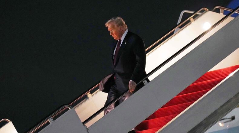 President Donald Trump walks off Air Force One, Wednesday, Nov. 5, 2025, at Joint Base Andrews, Md., after a day trip to Miami. (AP Photo/Jacquelyn Martin)