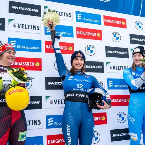 Runner-up Julia Taubitz, of Germany, from left, winner Hannah Prock, of Austria, and third-placed Verena Hofer, of Italy, celebrate on the podium following the Luge Women World Cup, single-seater, 2nd run in Winterberg, Germany, Saturday, Jan. 10, 2026. (David Inderlied/dpa via AP)