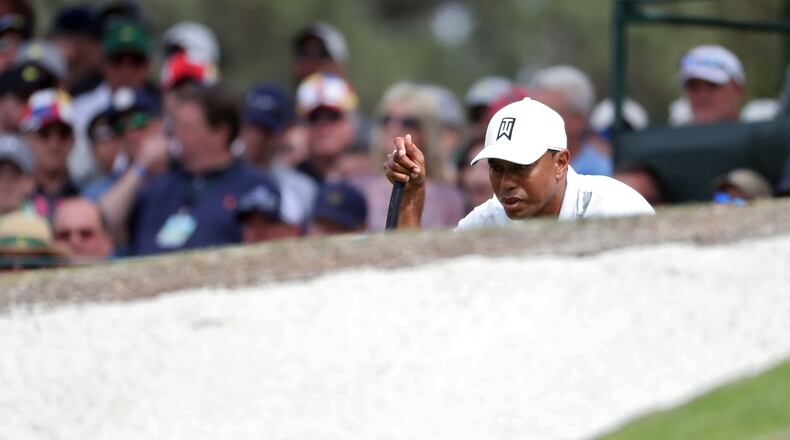 Tiger Woods lines up his putt on No. 7 during the second round of the Masters Tournament on April 6, 2018, at Augusta National Golf Club. PHOTO / JASON GETZ