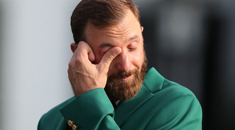 Dustin Johnson shows his emotions after Tiger Woods presented him the green jacket for winning last November's Masters. (Curtis Compton/Atlanta Journal-Constitution/TNS)