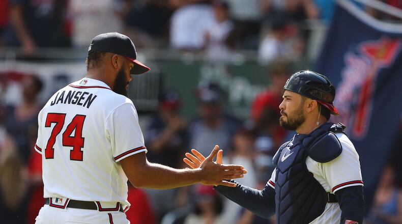 Braves pitcher Kenley Jansen gets five from catcher Travis d'Arnaud while closing out the Miami Marlins during the ninth inning for a 6-3 victory in a MLB baseball game on Sunday, May 29, 2022, in Atlanta.    “Curtis Compton / Curtis.Compton@ajc.com”