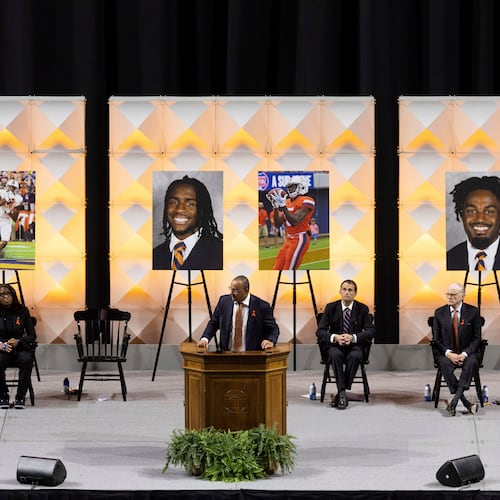 FILE - University of Virginia head football coach Tony Elliott speaks at a memorial service for three football players that were fatally shot, in Charlottesville, Va., Nov. 19, 2022. (Mike Kropf/The Daily Progress via AP, File)