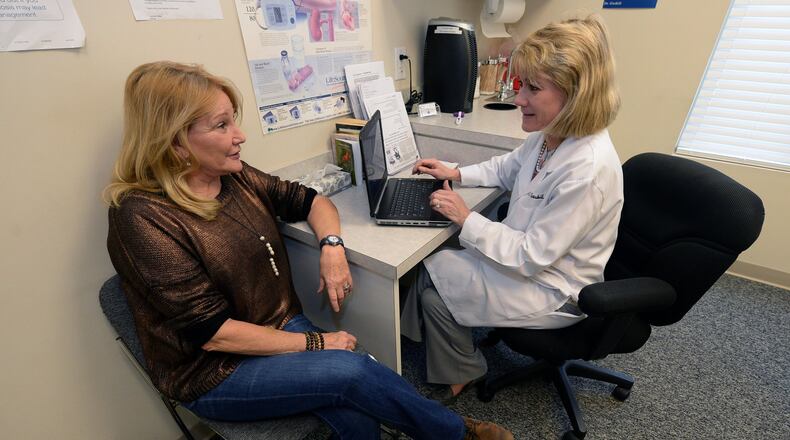 Jane Davenport talks to Dr. Leslie Gaskill inside her office on Wednesday, November 27, 2013. In the Spring of 2012, Davenport suffered a stroke. A friend suggested she see Dr. Gaskill.