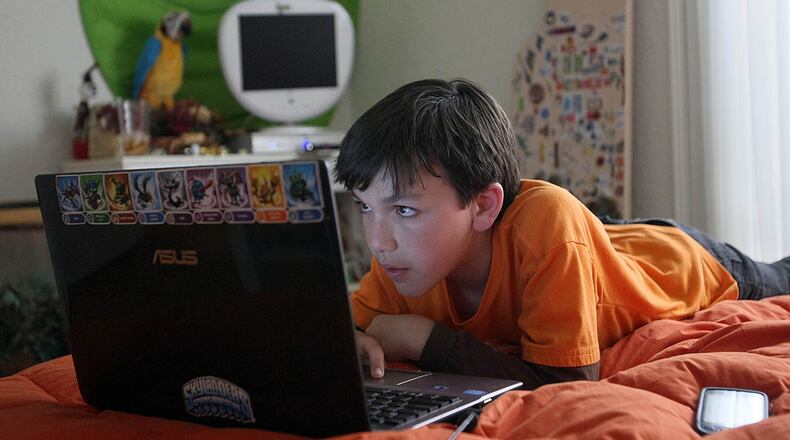 As the temperatures drop, kids will spend less time outside. That doesn't mean they should spend more time on the computer. (Gary Friedman/Los Angeles Times/MCT)