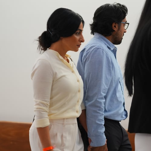 Nausheen Gilkar, left, and her husband Omar Ahmed arrive for a court hearing in Dallas, Tuesday, Aug. 25, 2026. (AP Photo/LM Otero)