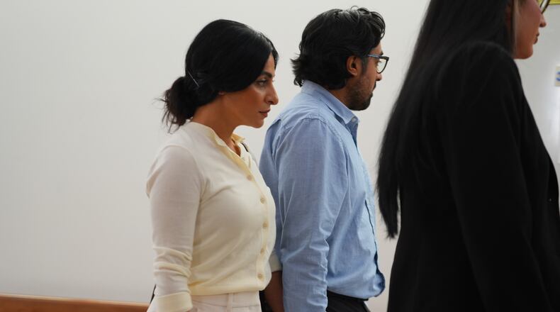 Nausheen Gilkar, left, and her husband Omar Ahmed arrive for a court hearing in Dallas, Tuesday, Aug. 25, 2026. (AP Photo/LM Otero)