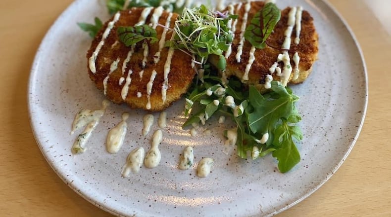 Crab cakes among the offerings at the Curious Pig gastropub. Courtesy of the Curious Pig.